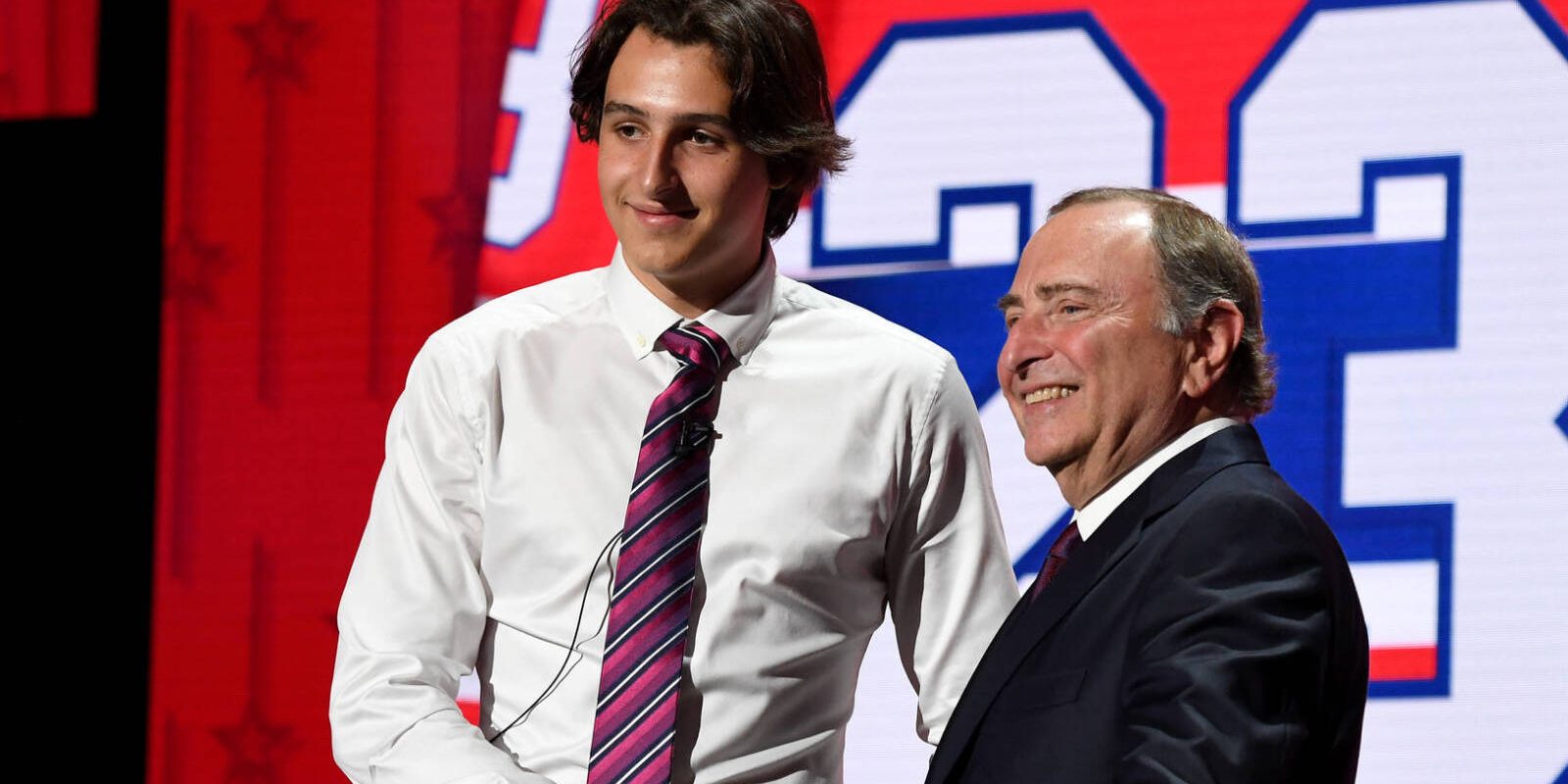 Jun 28, 2023; Nashville, Tennessee, USA; Montreal Canadians draft pick David Reinbacher shakes hands with NHL commissioner Gary Bettman after being selected with the fifth pick in round one of the 2023 NHL Draft at Bridgestone Arena. Mandatory Credit: Christopher Hanewinckel-USA TODAY Sports