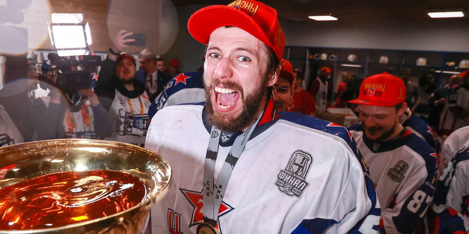 MAGNITOGORSK, CHELYABINSK REGION, RUSSIA - APRIL 30, 2022: HC CSKA Moscow's goaltender Ivan Fedotov drinks champagne from a trophy in a locker room after winning Leg 7 of their 2021/22 Kontinental Hockey League Gagarin Cup Final tie (final best-of-seven series of annual KHL playoffs) against HC Metallurg Magnitogorsk at the Metallurg Arena. Sergei Fadeichev/TASS/Sipa USA
