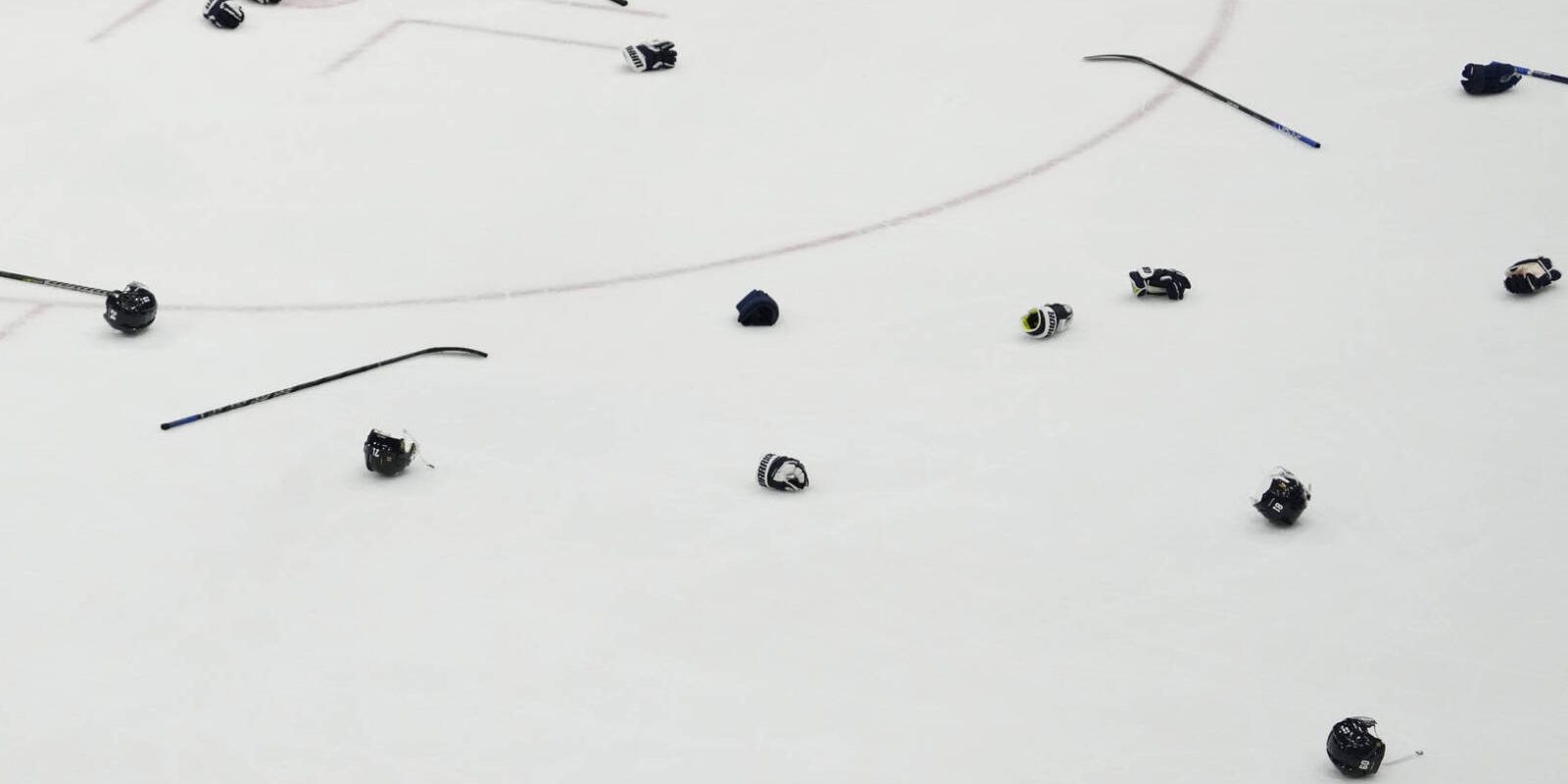 Feb 20, 2022; Beijing, China; A view of sticks, gloves, and helmets of Team Finland players during their celebration after the game against Team ROC during the Beijing 2022 Olympic Winter Games at National Indoor Stadium. Mandatory Credit: George Walker IV-USA TODAY Sports